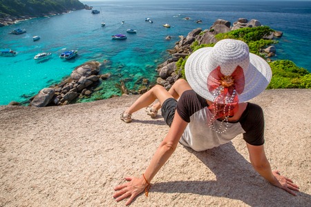 Fashionable tourist looking panorama from Sail Rock View Point of Kor 8 of Similan Islands National Park, Phang Nga, Thailand, one of the tourist attraction of the Andaman Sea.の写真素材