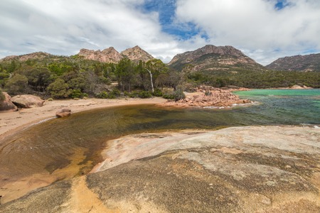 Honeymoon Bay is located near Coles Bay in the Freycinet Peninsula.The Freycinet National Park,is a paradise of pink granite mountains,white beaches and turquoise sea on Tasmanias east coast,Australiaの写真素材