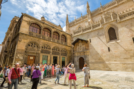 Tourists waiting time for afternoon opening of the Royal Chapel in Granada Cathedral, Granada town, Andalusia, Spain.のeditorial素材