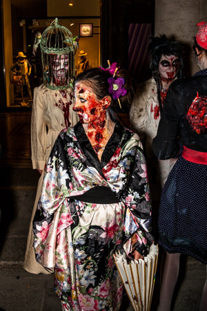Bologna, Italy - May 21, 2016: Bologna zombie apocalypse walk. Close up of the face of a rotten, bloody and terrifying zombie.のeditorial素材
