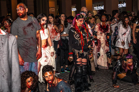 Bologna, Italy - May 21, 2016: Bologna zombie apocalypse walk, a group of people dressed as zombies and scary expressions during a parade through the center of the city.のeditorial素材