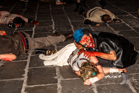 Bologna, Italy - May 21, 2016: Bologna zombie apocalypse walk: a group of zombies crawling on the ground.のeditorial素材