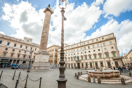Rome, Italy - May 12, 2016: Police and tourists in Piazza Colonna famous for the Column of Marcus Aurelius and to be surrounded by some of the most important historical buildings in Rome.のeditorial素材