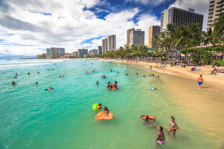 Waikiki, Oahu, HI - August 27, 2016: Prince Kuhio Beach also called The Ponds, because bounded by concrete walls that have created a calm water swimming pool. Kuhio Beach is great for boogie boarding.のeditorial素材