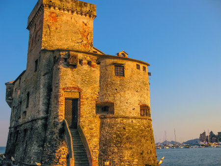 The medieval castle at sunset in Rapallo, famous Italian tourist resort close to Portofino and Santa Margherita Ligure in the province of Genoa, Ligury, Italy.のeditorial素材