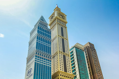 Dubai, UAE - May 1, 2013: Al Yaqoub Tower, Capricorn Tower, Al Rostamani Maze Tower on Sheikh Zayed Road in Downtown of Dubai. Maze Tower overlooks the Dubai International Financial Centre.のeditorial素材