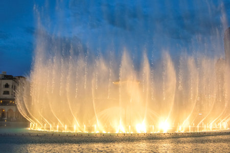 Night view of the light show at Dubai Fountain. The Dancing Fountain of Dubai performs to the beat of music near Burj Khalifa and Dubai Mall in downtown of Dubai.のeditorial素材