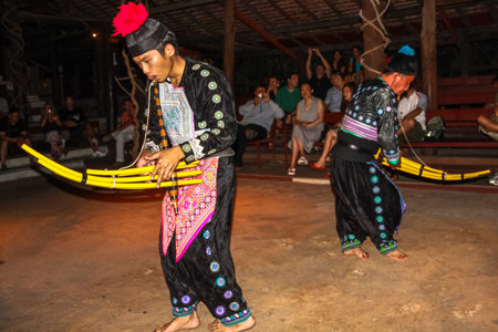 Chiang Mai, Thailand - July 24, 2011: musicians dressed in traditional dress playing during folk...