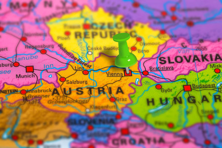 Vienna in Austria pinned on colorful political map of Europe. Geopolitical school atlas. Tilt shift...
