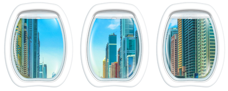 Three plane windows on Sheikh Zayed Road, highway E 11 in Dubai, United Arab Emirates, from a plane on the porthole windows. Copy space.の写真素材
