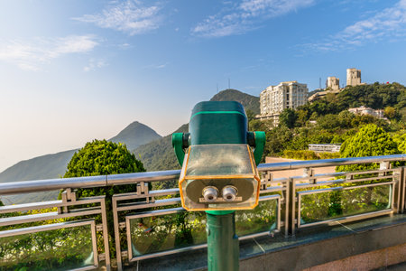 Hong Kong, China - December 7, 2016: Tourist binocular at free viewing terrace of Victoria Peak Galleria, a grand shopping center near the Peak Tower the island's highest viewing platform.のeditorial素材