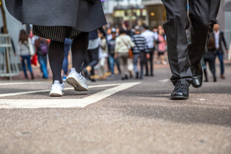 Asian families, tourists and workers walking through crowded Jardine's Crescent, Causeway Bay shopping district, a popular roadside bazaar to shop, Hong Kong, China. low angle view.のeditorial素材