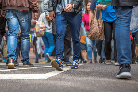 close up of elegant casual men legs walking in street market Jardine's Crescent, Causeway Bay,...