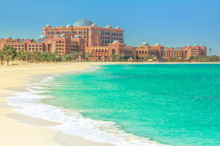 Abu Dhabi, United Arab Emirates - April 21, 2013: white beach of Emirates Palace Hotel, a luxurious seven star hotel with its own marina and helipad. Summer holidays concept. Luxury and lifestyle amenities.のeditorial素材