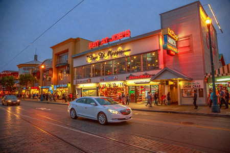 San Francisco, California, United States - August 14, 2016: twilight on Jefferson Road. Waterfront of Fisherman's Wharf. Holidays, lifestyle and nigthlife concept. Urban street view and cityscape.のeditorial素材