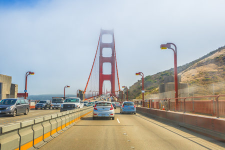 San Francisco, California, United States - August 16, 2016: point of view of car crossing Golden Gate Bridge from Presidio Pacific point to the north. In the traffic to and from the city.のeditorial素材