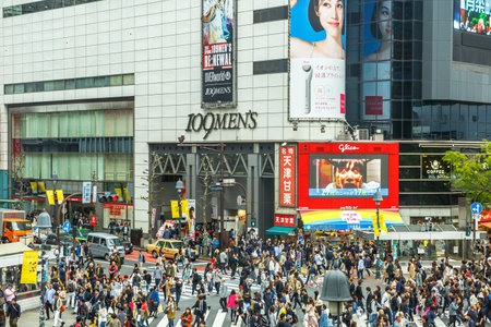 Tokyo, Japan - April 22, 2017: aerial view from Occitane Cafe of unidentified pedestrians in Shibuya Crossing, one of the busiest crosswalks in the world.Shibuya Crossing a popular attraction in Tokyoのeditorial素材