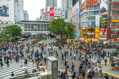 Tokyo, Japan - April 22, 2017: aerial view from Starbucks in front of Shibuya Station and LOccitane Cafe, of popular Shibuya Crossing, one of the busiest crosswalks in the world.のeditorial素材