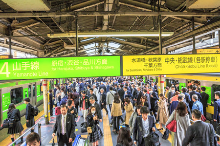 Tokyo, Japan - April 17, 2017: commuters at rush hour in Shinjuku Station. Yamanote Line (loop) that connects all metro lines and Sobu Line local to a slower metro service that crosses the Yamanoteのeditorial素材
