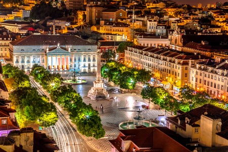 Scenic aerial view of Rossio Square or Pedro IV Square in Lisbon downtown, Portugal, from panoramic platform of Elevador de Santa Justa. Architecture background. Urban cityscape skyline. Night scene.の写真素材
