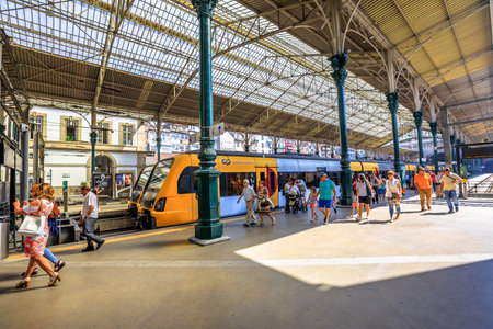 Porto, Portugal - August 13, 2017: train on platform of Sao Bento Railway Station, Oportos main station. Tourists and locals use the station to move from one city to another in Portugal.のeditorial素材