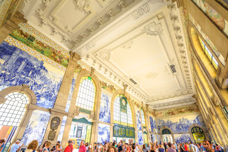 Porto, Portugal - August 13, 2017: bottom view of historic main hall and Unesco Heritage of Sao Bento Railway Station, a train station famous for painted ceramic tileworks, the traditional Azulejos.のeditorial素材