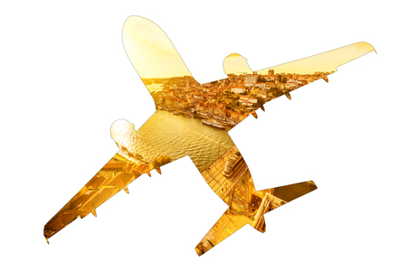 Tourism and holidays concept. Airplain silhouette, bottom view, with image of Douro River Bridge and Porto skyline in Portugal. Transport and travel concept. Isolated on white background. Copy space.の写真素材