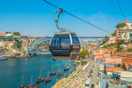 Porto, Portugal - August 13, 2017: Aerial view of Dom Luis I Bridge on Douro River, Monastery of Serra do Pilar and Riberira skyline from Teleferico de Gaia, a cable car in Vila Nova de Gaia.のeditorial素材