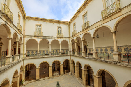 Coimbra, Portugal - August 14, 2017: cloister inside University of Coimbra, the Europes oldest university founded in 1290. Unesco Heritage Site and most important tourist attraction in Coimbra.のeditorial素材