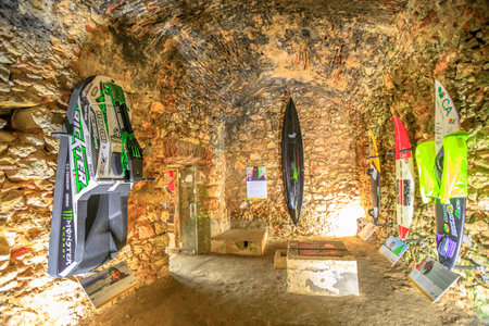 Nazare, Portugal - August 15, 2017: Surfers museum exhibition inside Fortress of St. Michael in Nazare Sitio near North Beach, one of the most impressive surf sites in the world.World-class surfboardsのeditorial素材