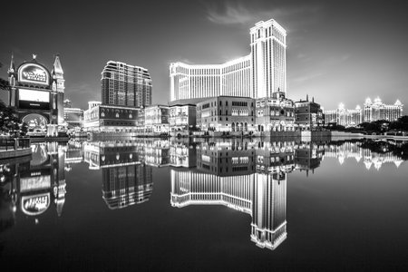 Macau, China - December 8, 2016: iconic The Venetian Macao reflecting on the lake, the largest casino in the world and the largest single structure hotel building in Asia. Black and white shot.のeditorial素材