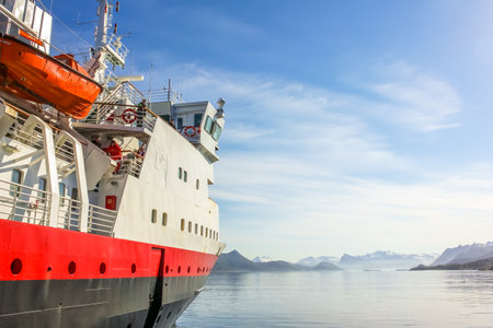 Norway, Europe - May 4, 2011: Hurtigruten, Norwegian postal boat, MS Vesteralen, one of our smaller boats in Norwegian Fjords of Lofoten Islands. Cruise ship holidays in Norwegian Coast.のeditorial素材