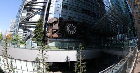 Tokyo, Japan - April 20, 2017: wide angle view of victorian steampunk Giant Ghibli clock. The clock is located in front of Nittele Tower Nippon Television headquarters in Shiodome area, Minato wardのeditorial素材