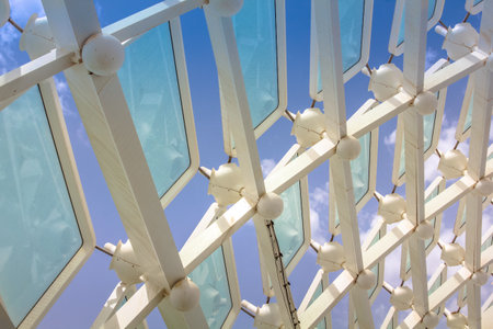 Abu Dhabi, UAE - April 22, 2013: Detail of glass panels inside the Yas Viceroy, Abu Dhabis Yas Island. The 5-star luxury Resort Hotel is located on Yas Marina Circuit. Glass windows background.のeditorial素材