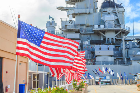 HONOLULU, OAHU, HAWAII, USA - AUGUST 21, 2016:American flags at Missouri Battleship Memorial in Pearl Harbor Honolulu Hawaii, Oahu island of United States. National historic patriotic landmark.のeditorial素材