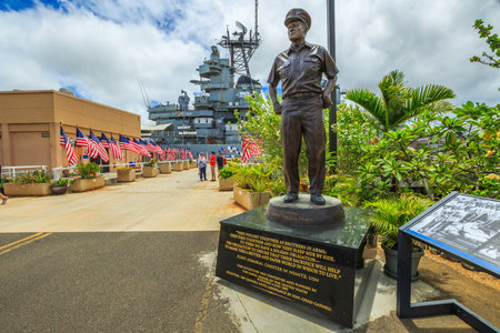 HONOLULU, OAHU, HAWAII, USA - AUGUST 21, 2016: statue of Admiral Chester W. Nimitz at battleship Missouri Pearl Harbor Memorial with American flags. Commander in chief of United States Pacific Fleet.のeditorial素材