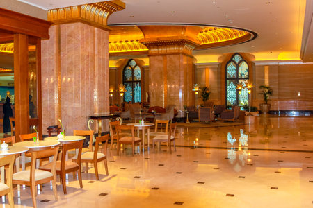 Abu Dhabi, United Arab Emirates - April 21, 2013: monumental entrance of Emirates Palace, luxurious hotel and landmark in Abu Dhabi. Decorations with gold, marble and Swarovski. Luxury travel concept.のeditorial素材