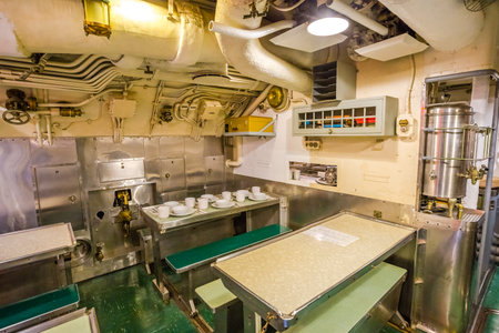 HONOLULU, OAHU, HAWAII, USA - AUGUST 21, 2016: dining room with table and chairs in USS Bowfin Submarine SS-287 at Pearl Harbor. Historic Landmark and popular tourist attraction in Oahu, Hawaii.のeditorial素材