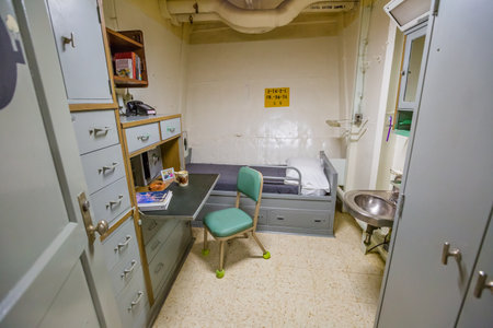 HONOLULU, OAHU, HAWAII, USA - AUGUST 21, 2016: small officer single room and personal office with washbasin, bed and teletypewriter of Battleship Missouri at Pearl Harbor, a military port in Oahu.のeditorial素材