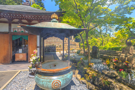 Kamakura, Japan - April 23, 2017: incense sticks burning inside giant bronze incense burner inside Hase-dera Temple in Kamakura, Kanagawa Prefecture, Japan.のeditorial素材