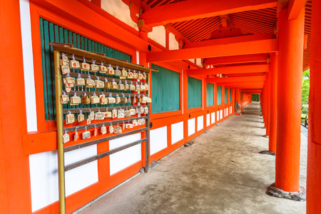 Nara, Japan - April 26, 2017: Wooden plaques or Ema, bearing peoples prayers at Kasuga-Taisha Shrine the Naras most celebrated shrine dedicated to the deity responsible for protection of city.のeditorial素材