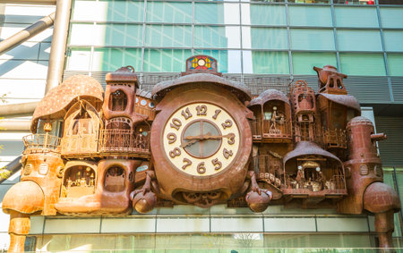 Tokyo, Japan - April 20, 2017: Giant Ghibli clock on facade of Nittele Tower or headquarters of Nippon Television in Shiodome area, Minato.It was designed by Hayao Miyazaki co-founder of Studio Ghibliのeditorial素材