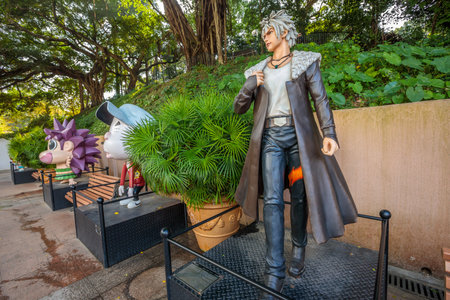 Hong Kong, China - December 5, 2016: Chan Lok-kwan,Cuson and Samba, statue of famous characters, in Hong Kong Avenue of Comic Stars, Kowloon Park. Urban tree background of Tsim Sha Tsui District.のeditorial素材