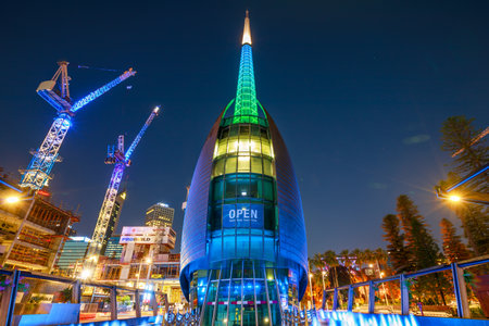Perth, Australia - Jan 5, 2018: Bell Tower or Swan Bell Tower and construction cranes illuminated by night lights in Perth city, Western Australia. The Barrack Square area is still under construction.のeditorial素材