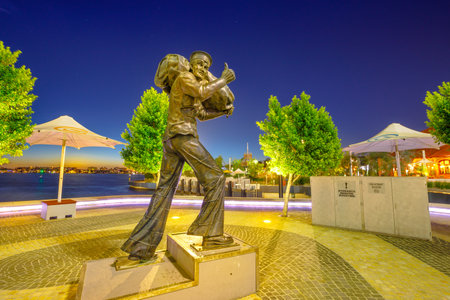 Perth, Australia - Jan 6, 2018: General Sir Talbot Hobbs Memorial Sculpture in Elizabeth Quay Marina waterfront, Western Australias most distinguished World War One soldier. Night scene.のeditorial素材