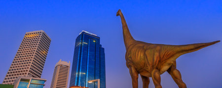 Perth, Australia - Jan 6, 2018: panorama of Perth Skyline Central Business District with large dinosaur sculpture exhibit at blue hour in Elizabeth Quay, Esplanade.のeditorial素材