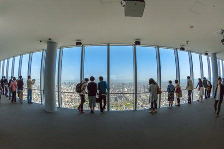 Osaka, Japan - April 30, 2017: tourists looking Osaka city at Abeno Harukas, the tallest skyscraper in Japan. The building stands on top of Kintetsu Osaka Abenobashi Station near JR Tennoji Station.のeditorial素材