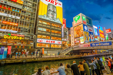 Osaka, Japan - April 29, 2017: people in Dotonbori Osaka, Namba District, in blue hour shot. The Dotonbori Canal is a famous sightseeing spot in Osaka and is a place visited by many tourists.のeditorial素材