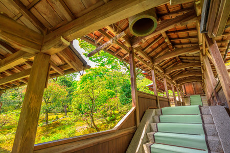 Kyoto, Japan - April 27, 2017:Architecture of Zen Temple Tenryu-ji in Arashiyama on western outskirts of Kyoto, Japan. The long covered corridor and staicase with iron bell that from the Hojo hall, leads to the tearooms.のeditorial素材