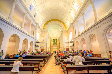 Fatima, Portugal - August 15, 2017: tourists and pilgrims pray inside the Basilica of Our Lady of Fatima, one of most important shrines dedicated to Virgin Mary and biggest pilgrimage Site in Portugalのeditorial素材